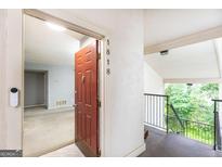 Inviting entryway to a condo with a bright interior and modern design elements, freshly painted at 1818 Huntingdon Chase, Atlanta, GA 30350