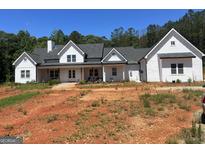 Charming new construction home with a white exterior and a covered front porch at 1333 Happy Hill Rd, Carrollton, GA 30116