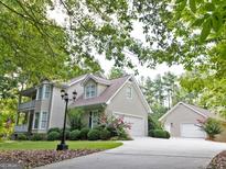 Charming home featuring an attached two-car garage and a detached one-car garage at 210 Farr Lake Dr, Tyrone, GA 30290