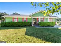 Charming single-story home with well-manicured lawn and colorful shutters at 120 Greenview Ter, Mcdonough, GA 30253