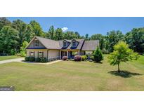 Inviting single-Gathering home with mature trees and lush landscaping at 70 Country Meadows Ln, Covington, GA 30014