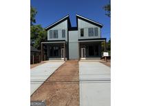 Modern two-story home with a symmetrical design, covered porch, and long driveways to each unit at 1223 Oakland Sw Dr # A, Atlanta, GA 30310