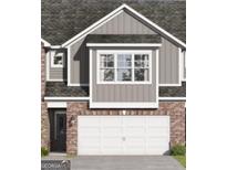 Exterior facade showing the garage, brick, siding, and windows at 2032 Piccolo Ct # 226, Mcdonough, GA 30252