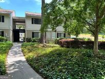Charming condominium exterior with manicured landscaping and inviting walkway at 1503 Wingate Way # 1503, Sandy Springs, GA 30350