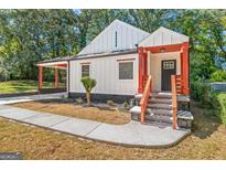 Charming craftsman home with inviting front porch and steps leading to the black front door at 317 Mcpherson Se Pl, Atlanta, GA 30316