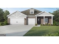 Charming brick home featuring a two-car garage and well-manicured lawn at 1217 Trombone Way # 6, Mcdonough, GA 30252