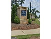 Inviting Hampton Preserve community entrance featuring brick signage and lush landscaping at 190 Hampton Cir, Mcdonough, GA 30253