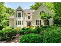 Charming two-story brick home with well-manicured landscaping and a symmetrical facade at 162 Daltree Ct, Marietta, GA 30068