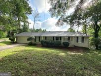 Charming brick home with a well-manicured front yard and inviting curb appeal at 3670 Broadview Ct, Decatur, GA 30032