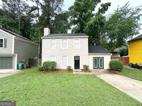 Charming two-story home with well-maintained lawn and inviting curb appeal at 1362 Mill Lake Cir, Stone Mountain, GA 30088