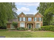 Charming two-story home with green shutters and a well-manicured lawn at 170 Glen Eagle Way, Mcdonough, GA 30253