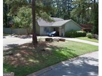 Charming single-story home with a well-maintained lawn and a cozy, inviting curb appeal at 8636 Woodside Ln, Jonesboro, GA 30238