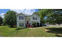 Charming two-story home with well-maintained lawn and beautiful landscaping in a desirable neighborhood at 8436 Cyprus Ridge Way, Douglasville, GA 30134