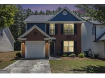 Charming two-story home with a brick and siding exterior, complemented by a well-maintained front yard at 1444 Gates Se Cir, Atlanta, GA 30316
