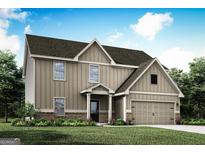 Beautiful two-story home with brown siding, a welcoming front porch and attached two-car garage at 446 Cantrell Drive, Dallas, GA 30157