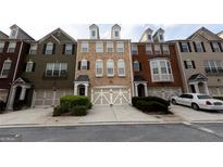 Charming townhomes with well-maintained front yards and garages in a desirable neighborhood at 6089 Indian Wood, Mableton, GA 30126