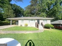 Charming single-story home with well-manicured lawn and a convenient carport at 2469 Baywood Se Dr, Atlanta, GA 30315