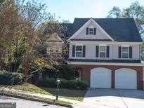 Charming two-story home with a two-car garage and well-maintained landscaping at 3700 Newhalem Sw St, Atlanta, GA 30331