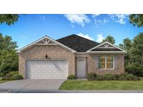 Charming one-story brick home featuring a two-car garage and manicured lawn at 139 Oakchase Park Ln, Hampton, GA 30228