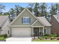 Charming craftsman home with a two-car garage, stone accents, and a well-maintained lawn at 3112 Patriot Sq, Marietta, GA 30064