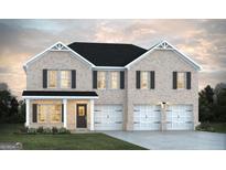 Charming two-story home features a brick facade, black shutters, and a three-car garage at 95 Jacoby Dr # 103, Fairburn, GA 30213