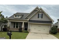 Charming craftsman-style home with a two-car garage and well-maintained landscaping at 471 Lanier Ct, Hiram, GA 30141