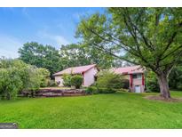 Charming single-Gathering home with mature trees and a spacious lawn at 2624 Windridge Dr, Acworth, GA 30102