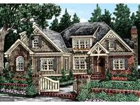 Charming two-story home with lush landscaping and brick details at 2039 Fischer Rd, Sharpsburg, GA 30277