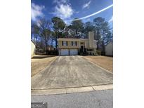 Inviting two-story home with a two-car garage and a spacious driveway at 6205 Littleton Dr, Union City, GA 30291