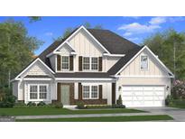 Charming two-story home showcasing board and batten siding, a two-car garage, and a beautifully landscaped front yard at 659 Bohannon Rd # 1, Grantville, GA 30220