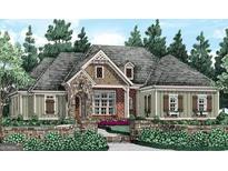 Charming one-story home with stone accents, lush landscaping, and a welcoming entrance at 2043 Fischer Rd, Sharpsburg, GA 30277