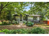 Charming single-Gathering home featuring mature landscaping and a welcoming front porch at 98 Maddox Dr, Mcdonough, GA 30252