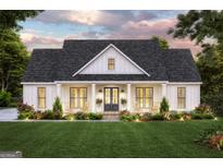 Charming one-story home with a welcoming front porch, rocking chairs, and manicured landscaping at 380 Ayers Rd, Bowdon, GA 30108