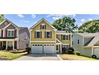 Charming two-story home with an attached two car garage, and complementary landscaping at 984 Wenham Ln, Lawrenceville, GA 30044