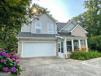 Charming two-story home featuring brick accents, a two-car garage, and a beautifully landscaped front yard at 2355 Brick Mill Ct, Duluth, GA 30096