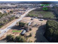 Expansive aerial view of the property highlighting its location near Hwy 155 and its proximity to commercial areas at 2353 Highway 155 N, Mcdonough, GA 30252