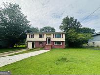 Charming two-story home with a well-maintained lawn and inviting entryway at 1766 Tilden Ave, Jonesboro, GA 30236