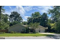 Charming single-story home with a two-car garage and a well-manicured lawn at 106 Lanyard Bnd, Peachtree City, GA 30269