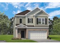 Charming two-story home with a brick-and-siding facade and an attached garage, complemented by a well-manicured lawn at 10409 Trellis Lane (Lot 34), Hampton, GA 30228