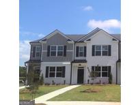 Charming townhome with a well-maintained lawn, black shutters, and contrasting paint trim at 352 Sound Cir, Stockbridge, GA 30281