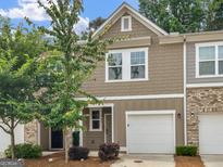 Charming townhome with attached garage and well-maintained landscaping at 3135 Journal Ct, Decatur, GA 30035