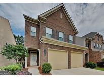 Charming two-story brick home featuring a two-car garage and well-maintained landscaping at 3712 Upland Dr, Mcdonough, GA 30253