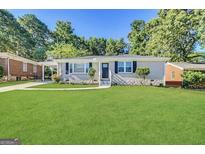 Charming single-story home with a well-manicured front yard and inviting curb appeal at 2015 Boulderview Se Dr, Atlanta, GA 30316