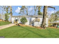 Charming one-story home with a well-manicured front lawn and inviting entryway at 2500 Brentwood Rd, Decatur, GA 30032