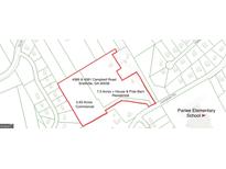 Aerial view showcasing the property lines of the land and its proximity to the surrounding area at 4389 & 4381 Campbell Rd, Snellville, GA 30039