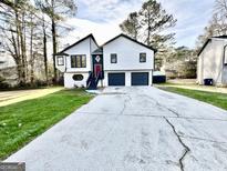 Charming two-story home with two-car garage and nicely manicured lawn at 295 Lamden Ct, Lawrenceville, GA 30046