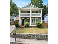 Charming two-story home with a welcoming front porch, perfect for relaxing and enjoying the neighborhood views at 187 Vanira Se Ave, Atlanta, GA 30315
