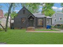 Charming single-Gathering home featuring a well-manicured lawn and a classic exterior design at 1042 Faith Se Ave, Atlanta, GA 30316