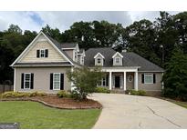 Charming home with manicured lawn, inviting entrance, and beautiful landscaping, offering great curb appeal at 237 Shockley Way, Dallas, GA 30157