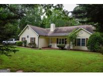 Charming home with a well-maintained lawn and mature trees at 640 Keys Ferry Rd, Mcdonough, GA 30252